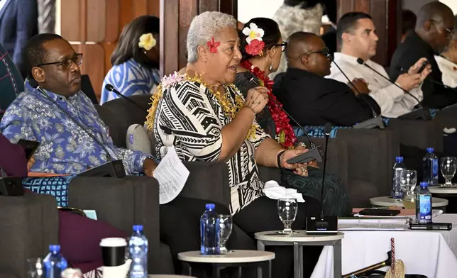 Samoa's Prime Minister, Afioga Fiame Naomi Mata'afa addresses the Leaders' Retreat during the Commonwealth Heads of Government Meeting (CHOGM) in Apia, Samoa, Saturday, Oct. 26, 2024. (William West/Pool Photo via AP)