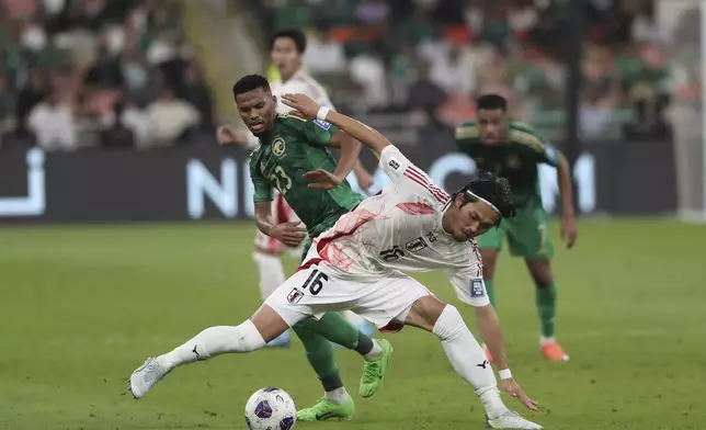 Japan's Koki Machida shoots the ball during the World Cup 2026 qualifier soccer match between Japan and Saudi Arabia at the King Abdullah Sports City, in Jeddah, Saudi Arabia, Thursday, Oct. 10, 2024. (AP Photo)