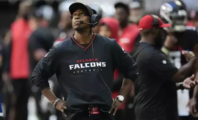 Atlanta Falcons head coach Raheem Morris paces on the sideline during the first half of an NFL football game against the Seattle Seahawks, Sunday, Oct. 20, 2024, in Atlanta. (AP Photo/ Mike Stewart )