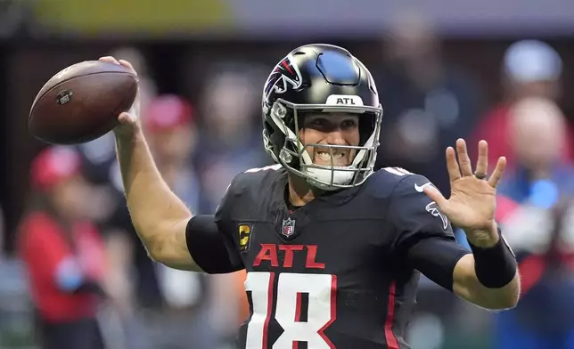 Atlanta Falcons quarterback Kirk Cousins (18) throws a pass during the first half of an NFL football game against the Seattle Seahawks, Sunday, Oct. 20, 2024, in Atlanta. (AP Photo/ Mike Stewart )