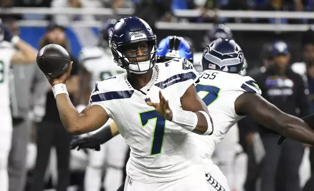 Seattle Seahawks quarterback Geno Smith throws during the first half of an NFL football game against the Detroit Lions, Monday, Sept. 30, 2024, in Detroit. (AP Photo/Jose Juarez)