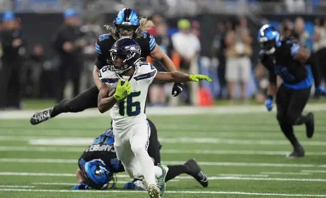 Seattle Seahawks wide receiver Tyler Lockett (16) rushes during the second half of an NFL football game against the Detroit Lions, Monday, Sept. 30, 2024, in Detroit. (AP Photo/Paul Sancya)