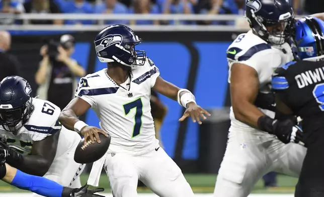 Seattle Seahawks quarterback Geno Smith (7) throws during the first half of an NFL football game against the Detroit Lions, Monday, Sept. 30, 2024, in Detroit. (AP Photo/Jose Juarez)