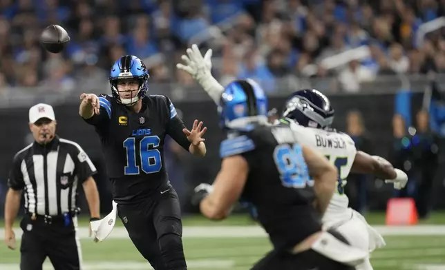 Detroit Lions quarterback Jared Goff (16) passes during the first half of an NFL football game against the Seattle Seahawks, Monday, Sept. 30, 2024, in Detroit. (AP Photo/Paul Sancya)