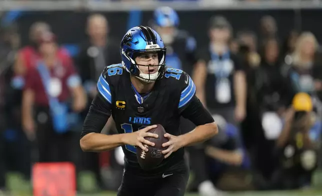 Detroit Lions quarterback Jared Goff looks to pass during the first half of an NFL football game against the Seattle Seahawks, Monday, Sept. 30, 2024, in Detroit. (AP Photo/Paul Sancya)