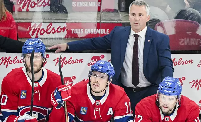 Montreal Canadiens head coach Martin St-Louis looks on from the bench during the first period of an NHL hockey game against the Ottawa Senators, Saturday, Oct. 12, 2024 in Montreal (Graham Hughes/Canadian Press via AP)