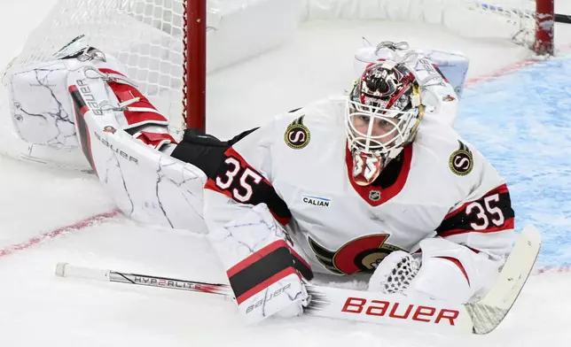 Ottawa Senators goaltender Linus Ullmark looks on after being scored on by Montreal Canadiens' Alex Newhook, during the third period of an NHL hockey game, Saturday, Oct. 12, 2024 in Montreal. (Graham Hughes/Canadian Press via AP)