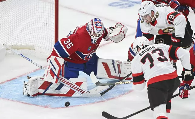 Ottawa Senators' Drake Batherson (19) and Noah Gregor (73) move in on Montreal Canadiens goaltender Sam Montembeault during the second period of an NHL hockey game, Saturday, Oct. 12, 2024 in Montreal. (Graham Hughes/Canadian Press via AP)