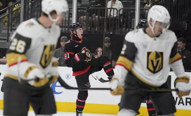 Ottawa Senators right wing Adam Gaudette celebrates after scoring against the Vegas Golden Knights during the first period of an NHL hockey game Friday, Oct. 25, 2024, in Las Vegas. (AP Photo/John Locher)