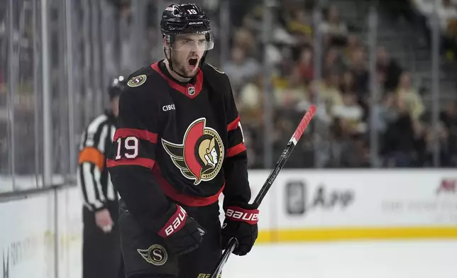 Ottawa Senators right wing Drake Batherson (19) celebrates after scoring against the Vegas Golden Knights during the first period of an NHL hockey game Friday, Oct. 25, 2024, in Las Vegas. (AP Photo/John Locher)