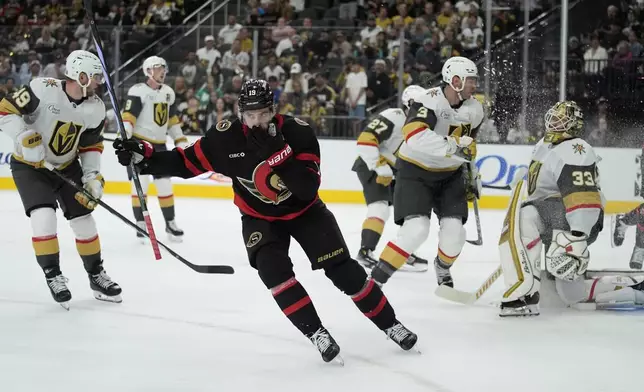 Ottawa Senators right wing Drake Batherson (19) celebrates after scoring against the Vegas Golden Knights during the first period of an NHL hockey game Friday, Oct. 25, 2024, in Las Vegas. (AP Photo/John Locher)