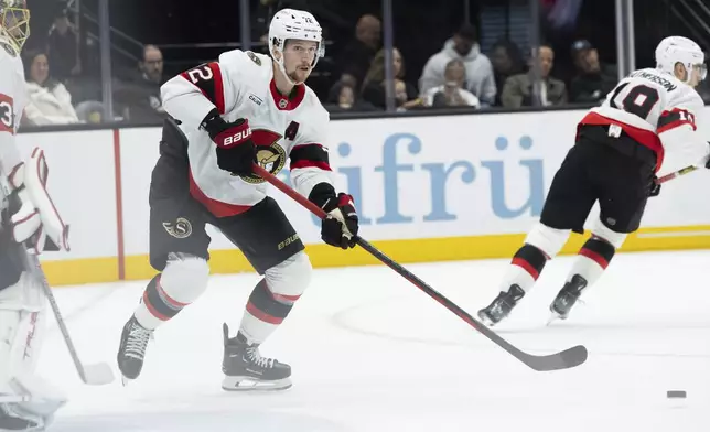 Ottawa Senators defensemen Thomas Chabot (72) moves the puck during the second period against the Utah Hockey Club at an NHL hockey game, Tuesday Oct 22, 2024, in Salt Lake City. (AP Photo/Melissa Majchrzak)