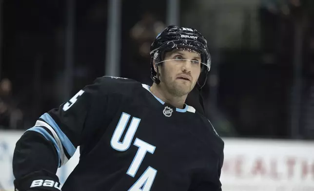 Utah Hockey Club forward Alexander Kerfoot (15) warms up prior to the game against Ottawa Senators during an NHL hockey game, Tuesday Oct 22, 2024, in Salt Lake City. (AP Photo/Melissa Majchrzak)