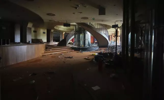 A view shows one of the halls at Hotel Yugoslavia, once a symbol of progress in the former socialist state of Yugoslavia that broke apart in the 1990s and a favorite gathering place for local residents as well as world leaders, in Belgrade, Serbia, Thursday, Oct. 3, 2024. (AP Photo/Darko Vojinovic)