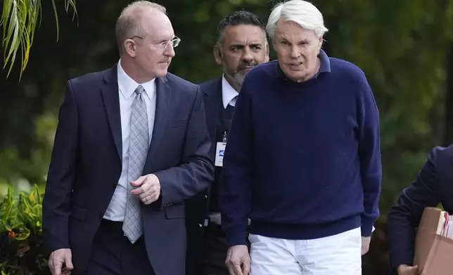 Michael Jeffries, right, former CEO of Abercrombie &amp; Fitch, leaves with his attorney Brian Bieber following a hearing at the Paul G. Rogers Federal Building and U.S. Courthouse, in West Palm Beach, Fla., Tuesday, Oct. 22, 2024. (AP Photo/Rebecca Blackwell)