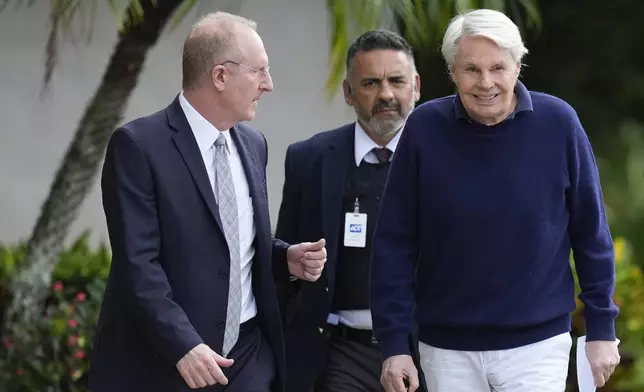 Michael Jeffries, right, former CEO of Abercrombie &amp; Fitch, leaves with his attorney Brian Bieber, left, following a hearing at the Paul G. Rogers Federal Building and U.S. Courthouse, in West Palm Beach, Fla., Tuesday, Oct. 22, 2024. (AP Photo/Rebecca Blackwell)