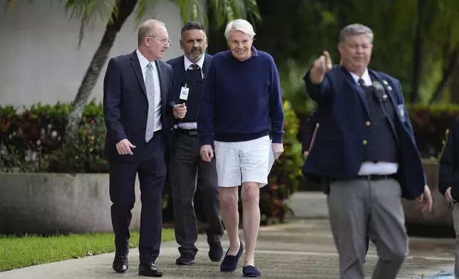 Michael Jeffries, center, former CEO of Abercrombie &amp; Fitch, leaves with his attorney Brian Bieber, left, following a hearing at the Paul G. Rogers Federal Building and U.S. Courthouse in West Palm Beach, Fla., Tuesday, Oct. 22, 2024. (AP Photo/Rebecca Blackwell)