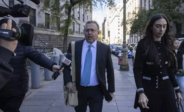 Attorney Marc Agnifilo, center, and Teny Geragos, right, for Sean "Diddy Combs, arrive at Manhattan federal court, Thursday, Oct. 10 2024, in New York. (AP Photo/Yuki Iwamura)