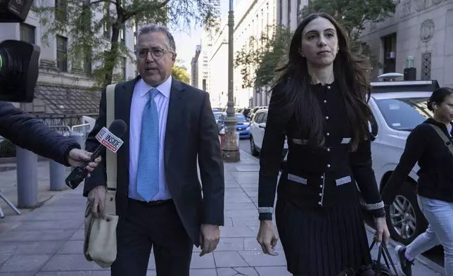 Attorney Marc Agnifilo, left, and Teny Geragos, right, for Sean "Diddy Combs, arrive at Manhattan federal court, Thursday, Oct. 10 2024, in New York. (AP Photo/Yuki Iwamura)