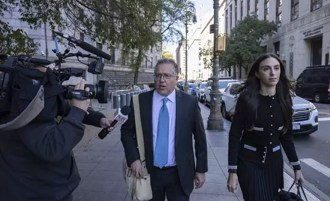 Attorney Marc Agnifilo, center, and Teny Geragos, right, for Sean "Diddy Combs, arrive at Manhattan federal court, Thursday, Oct. 10 2024, in New York. (AP Photo/Yuki Iwamura)