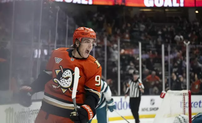 Anaheim Ducks center Leo Carlsson (91) celebrates his goal during the third period of an NHL hockey game against the San Jose Sharks, Tuesday, Oct. 22, 2024, in Anaheim, Calif. (AP Photo/Kyusung Gong)