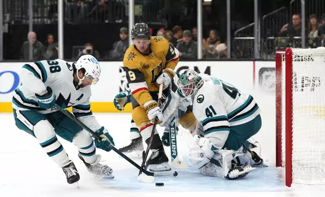 Vegas Golden Knights center Jack Eichel (9) attempts to score against San Jose Sharks goaltender Vitek Vanecek (41) during the second period of an NHL hockey game Saturday, Oct. 26, 2024, in Las Vegas. (AP Photo/Lucas Peltier)
