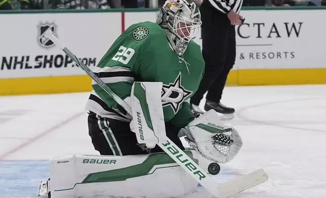 Dallas Stars goaltender Jake Oettinger (29) defends the goal during the second period of an an NHL hockey game against the San Jose Sharks Tuesday, Oct. 15, 2024, in Dallas. (AP Photo/LM Otero)