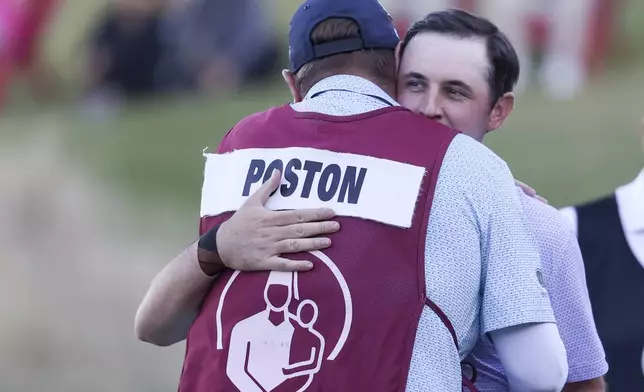 J.T. Poston hugs his caddie, Aaron Flener, after winning the Shriners Children's Open golf tournament, Sunday, Oct. 20, 2024, in Las Vegas. (AP Photo/Ian Maule)