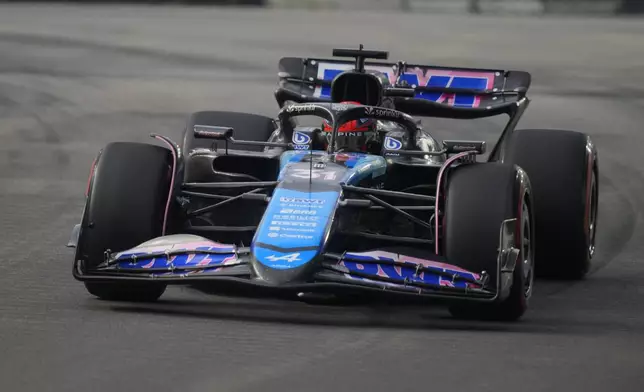 Alpine driver Esteban Ocon of France steers his car during the third practice session of the Singapore Formula One Grand Prix at the Marina Bay Street Circuit, in Singapore, Saturday, Sept. 21, 2024. (AP Photo/Vincent Thian)