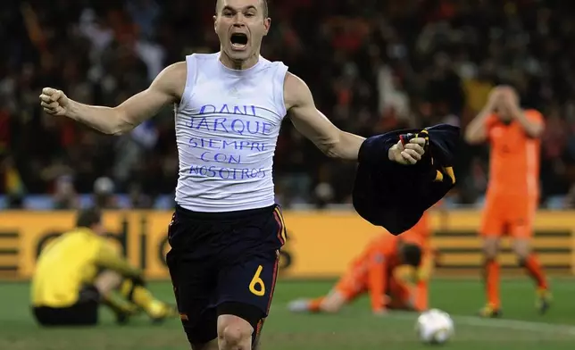 FILE - Spain's Andres Iniesta celebrates after scoring the only goal in the World Cup final soccer match against the Netherlands at Soccer City in Johannesburg, South Africa, July 11, 2010 file photo. (AP Photo/Martin Meissner, File)