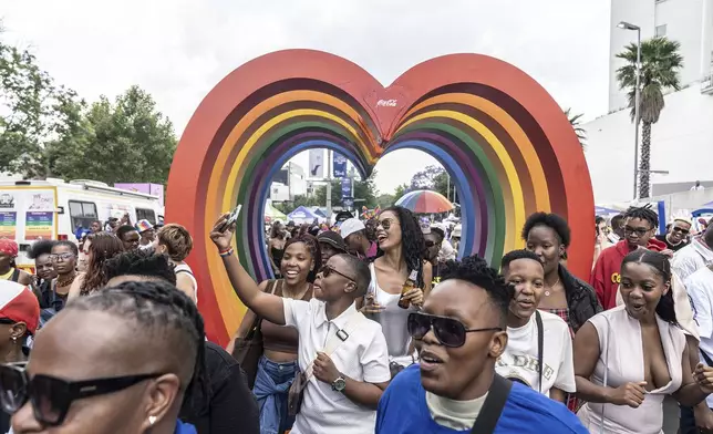 Members of the LGTBQ community take selfies in a Pride march in Johannesburg, South Africa Saturday, Oct 26, 2024. (AP Photo)