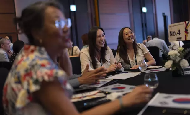 Maja Andersen, right, an adoptee visiting from Denmark to search for her birth family, and her daughter, Yasmin, attend the Overseas Korean Adoptees Gathering in Seoul, South Korea, Tuesday, May 21, 2024. (AP Photo/Jae C. Hong)