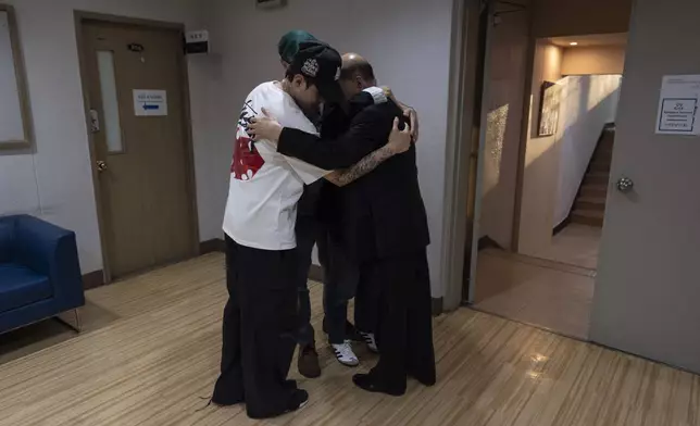 Jang Dae-chang hugs his daughter, Nicole Motta, and her family at the Eastern Social Welfare Society in Seoul on Friday, May 31, 2024, following their emotional first meeting. Motta, whose Korean name is Jang Hyeon-jung, was adopted by a family in Alabama, United States, in 1985. (AP Photo/Jae C. Hong)