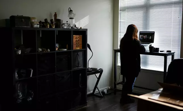 Rebecca Kimmel talks with her adoptive parents on her laptop at her home Saturday, Feb. 3, 2024, in Seattle. Her adoptive parents have also struggled with their unintended role in a deeply flawed system. Thousands of South Korean adoptees are looking to satisfy a raw, compelling urge that much of the world takes for granted: the search for identity. (AP Photo/Lindsey Wasson)