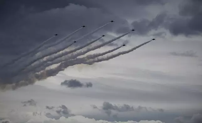 The Black Eagles, the aerobatic team of T-50 jets belonging to South Korea's Air Force, perform during a celebration to mark 76th anniversary of Korea Armed Forces Day, in Seongnam, South Korea, Tuesday, Oct.1, 2024. (Kim Hong-Ji/Pool Photo via AP)