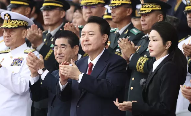 South Korean President Yoon Suk Yeol, center right, and his wife Kim Keon Hee attend a celebration to mark the 76th anniversary of Korea Armed Forces Day in Seongnam, South Korea Tuesday, Oct. 1, 2024. (Kim Hong-Ji/Pool Photo via AP)