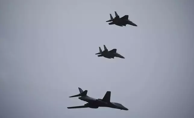 A U.S. Air Force B1 Bomber flies with South Korean Air Force's F-15K fighter jets during a celebration to mark 76th anniversary of Korea Armed Forces Day, in Seongnam, South Korea, Tuesday, Oct.1, 2024. (Kim Hong-Ji/Pool Photo via AP)