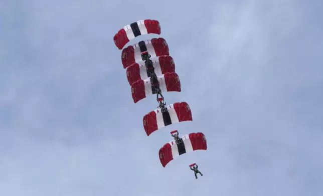 South Korean special army soldiers parachute down during the media day for the 76th anniversary of Armed Forces Day at Seoul air base in Seongnam, South Korea, Wednesday, Sept. 25, 2024. (AP Photo/Ahn Young-joon)