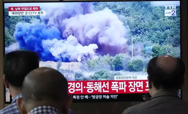 A TV screen reports North Korea has blown up parts of northern side of inter-Korean roads during a news program at Seoul Railway Station in Seoul, South Korea, Tuesday, Oct. 15, 2024. (AP Photo/Ahn Young-joon)