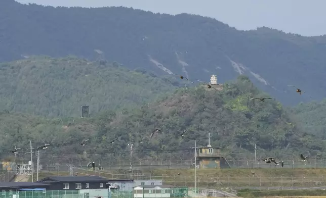 A North Korean loudspeaker, top left, a military guard post, top right, and a South Korean military guard post, bottom, are seen from Paju, South Korea, near the border with North Korea, Thursday, Oct. 10, 2024. (AP Photo/Ahn Young-joon)