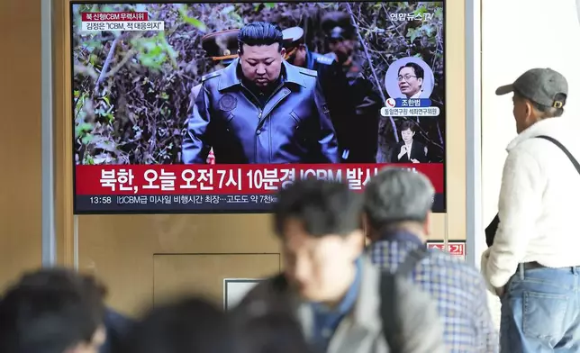 A TV screen shows an image of North Korean leader Kim Jong Un during a news program at the Seoul Railway Station in Seoul, South Korea, Thursday, Oct. 31, 2024. The letters read "North Korea, launched a new intercontinental ballistic missile today." (AP Photo/Lee Jin-man)