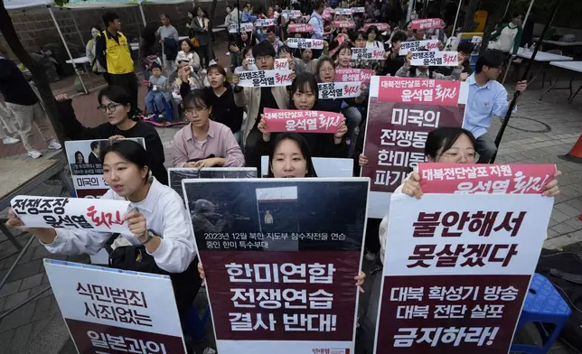 South Korean protesters stage a rally against flying of anti-North Korean propaganda leaflets into North Korea, in Seoul, South Korea, Saturday, Oct. 19, 2024. The banners read, "Opposition to South Korea-U.S. joint war exercise." (AP Photo/Ahn Young-joon)
