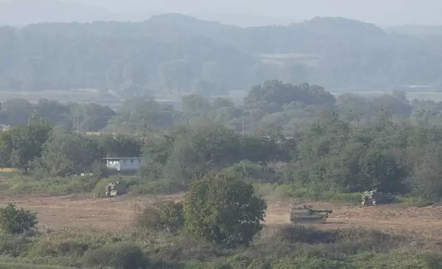 South Korean army K-9 self-propelled howitzers park in Paju, South Korea, near the border with North Korea, Thursday, Oct. 17, 2024. (AP Photo/Ahn Young-joon)