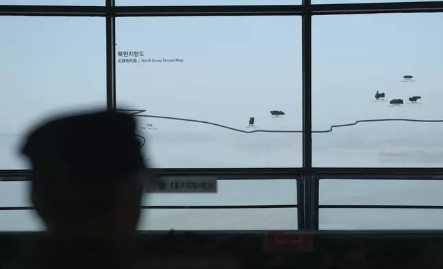 A visitor looks at the North Korean side from the unification observatory in Paju, South Korea, Thursday, Oct. 31, 2024. (AP Photo/Lee Jin-man)