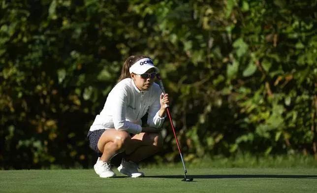 enny Shin of South Korea lines up a putt on the 12th green during the second round of the LPGA Ladies Championship golf tournament at the Seowon Valley Country Club in Paju, South Korea, Saturday, Oct. 19, 2024. (AP Photo/Lee Jin-man)