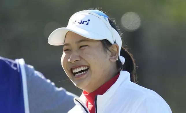 Chanettee Wannasaen of Thailand smiles on the second hole during the final round of the LPGA Ladies Championship golf tournament at the Seowon Valley Country Club in Paju, South Korea, Sunday, Oct. 20, 2024. (AP Photo/Lee Jin-man)