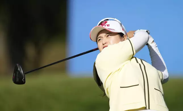 Hye-jin Choi of South Korea watches her tee shot on the 15th hole during the second round of the LPGA Ladies Championship golf tournament at the Seowon Valley Country Club in Paju, South Korea, Saturday, Oct. 19, 2024. (AP Photo/Lee Jin-man)