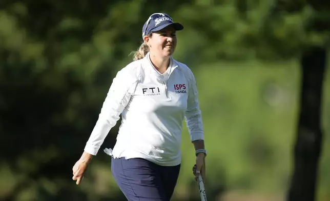 Ashleigh Buhai of South Africa reacts on the 12th green during the second round of the LPGA Ladies Championship golf tournament at the Seowon Valley Country Club in Paju, South Korea, Saturday, Oct. 19, 2024. (AP Photo/Lee Jin-man)