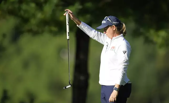 Ashleigh Buhai of South Africa lines up a putt on the 12th green during the second round of the LPGA Ladies Championship golf tournament at the Seowon Valley Country Club in Paju, South Korea, Saturday, Oct. 19, 2024. (AP Photo/Lee Jin-man)