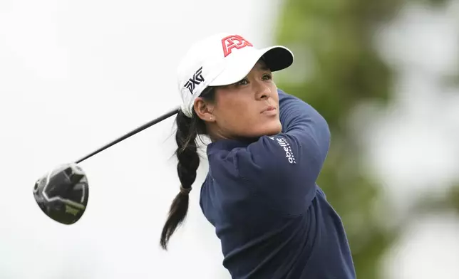 Celine Boutier of France watches her tee shot on the sixth hole during the third round of the LPGA Ladies Championship golf tournament at the Seowon Valley Country Club in Paju, South Korea, Saturday, Oct. 19, 2024. (AP Photo/Lee Jin-man)